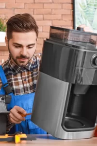 Coffee machine technician servicing an espresso machine