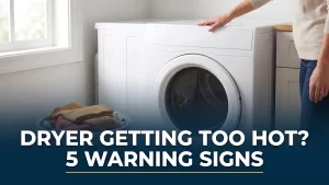 Hand checking the top of a dryer getting too hot in a bright Halifax laundry room